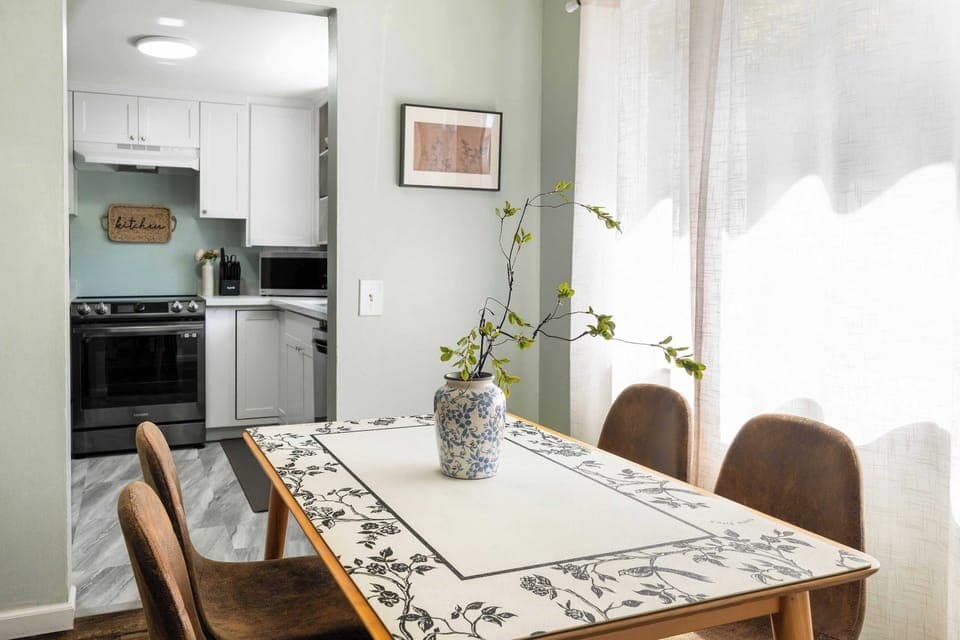 Here is the dinning table next to a bright window