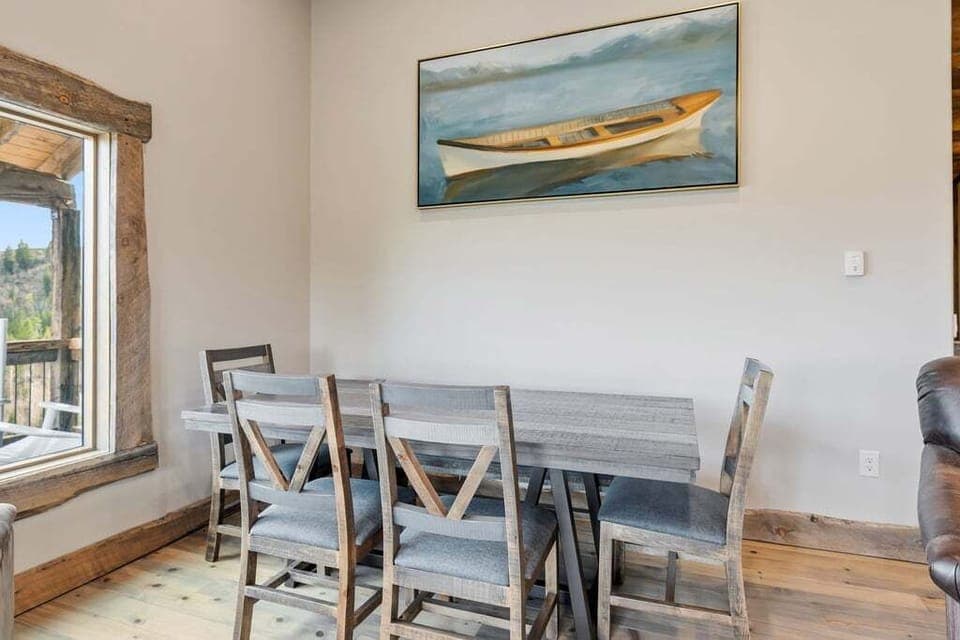 Gather around your dining table for memorable meals at 128 GCR 4034, where rustic charm meets modern comfort in this inviting space.