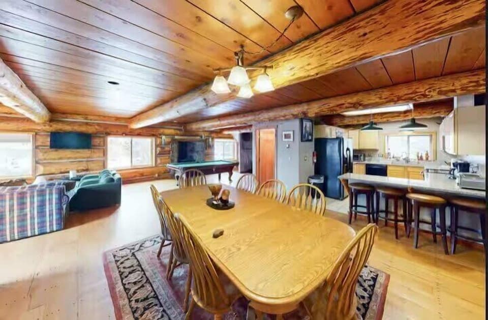 Dining area: Main floor, table seating for 9, 3 barstools, patio access