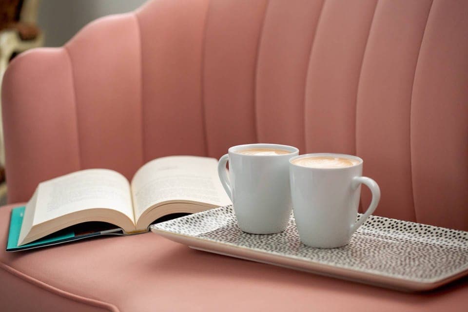 Curl up with a book and a latte—this cozy corner is made for quiet moments and warm conversations.
