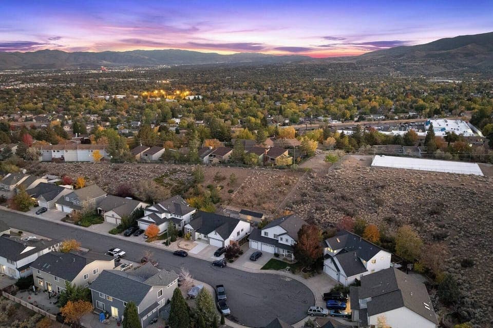 Aerial view showcasing curb appeal and surrounding greenery.