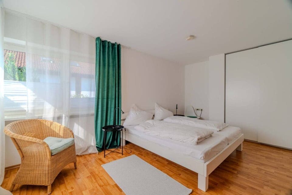 Well-lit, modern room with double bed