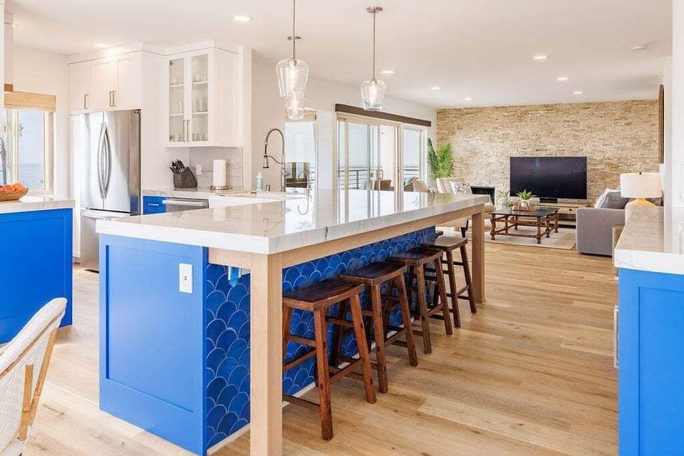 Additional seating for seven at the kitchen counter with sleek bar stools.