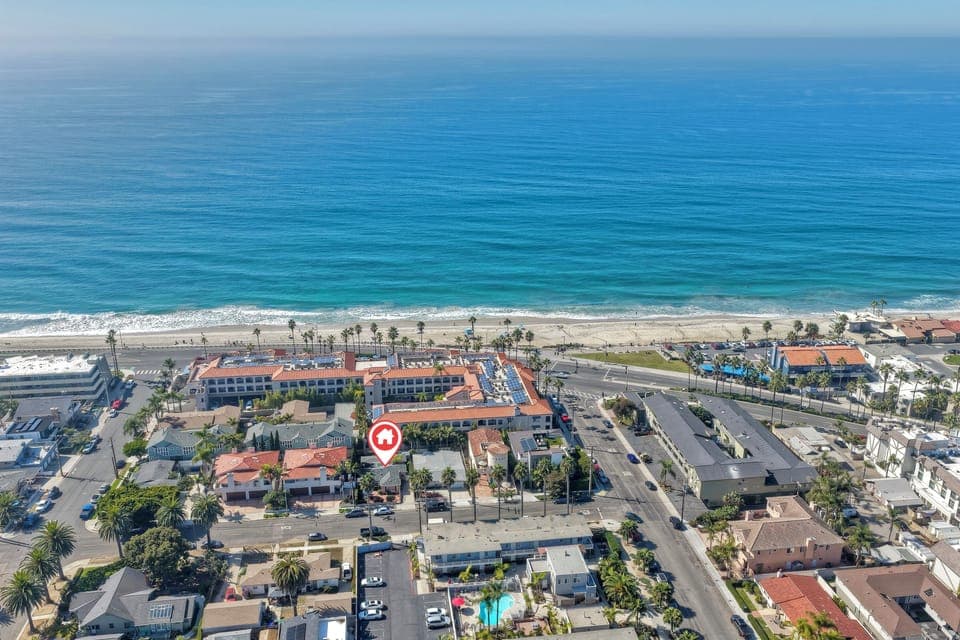 Genuine one-block stroll to sandy beach.