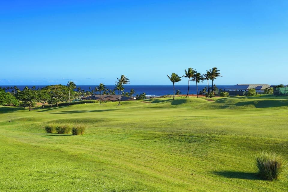 Golf course and ocean views stretching across Kauai’s sunny South Shore.