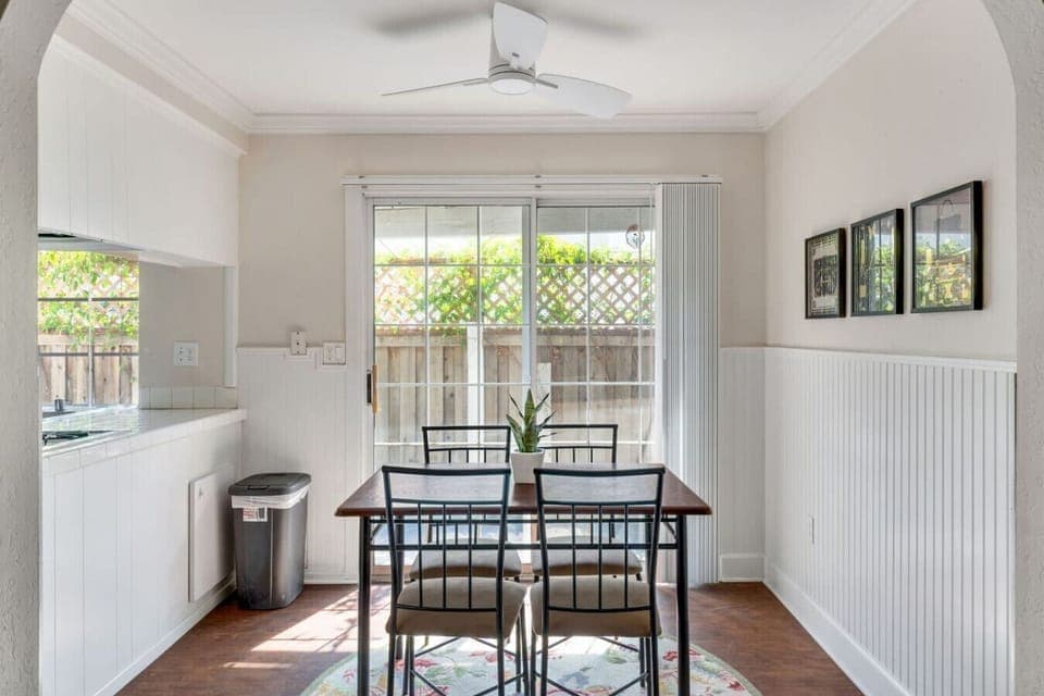 Enjoy home-cooked meals in the sunlit dining area by the patio.