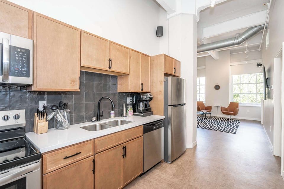 The sleek kitchen offers ample space & all the comforts of home​