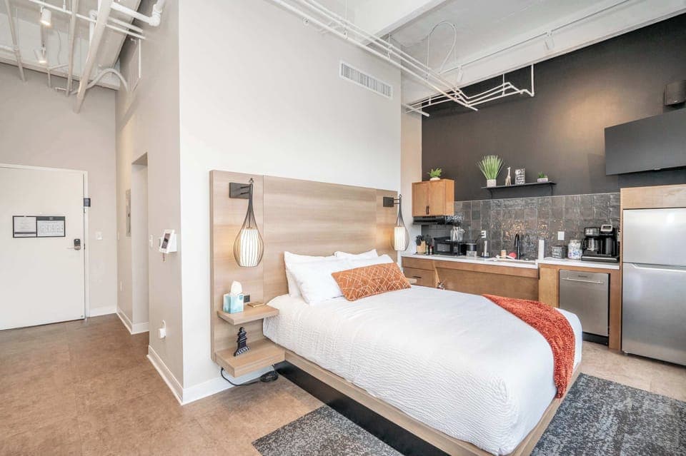 This home’s plush queen bed is ideal for recharging after a day on the town​