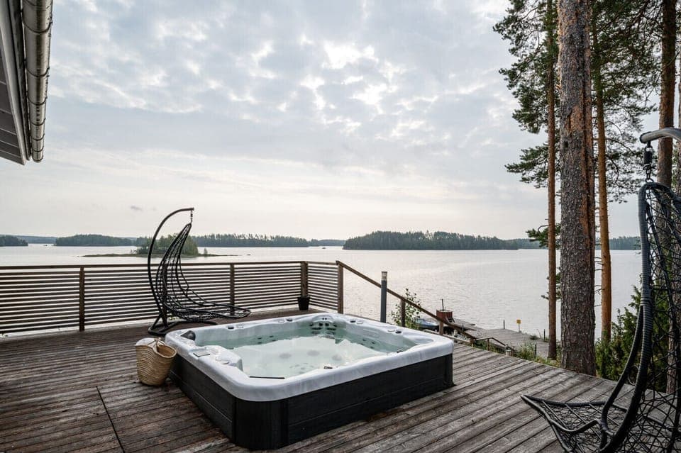 This secluded terrace is the perfect spot to watch the sunset over the water from the comfort of the hot tub.