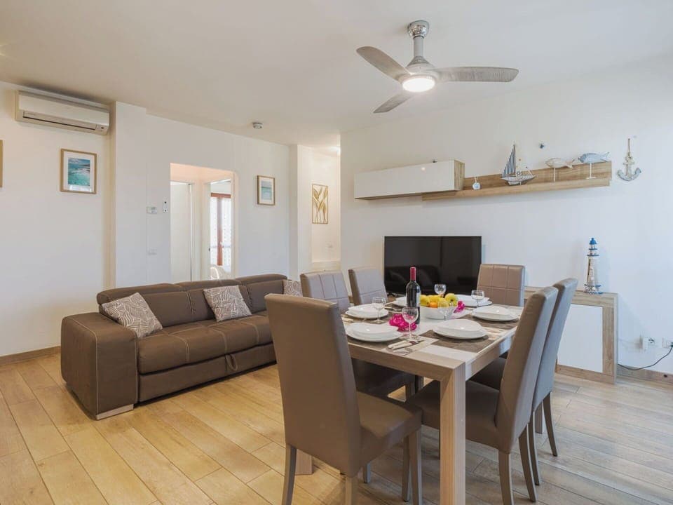 Furniture, Interior Design, Flooring, Floor, Wood, Room, Ceiling, Table, Couch, Lighting