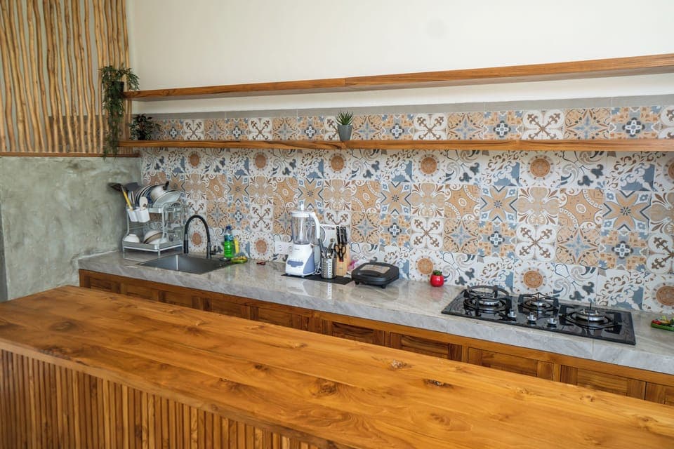 Superior Double Room, Balcony, Pool View | Shared kitchen facilities | Full-size fridge, microwave, coffee/tea maker, electric kettle