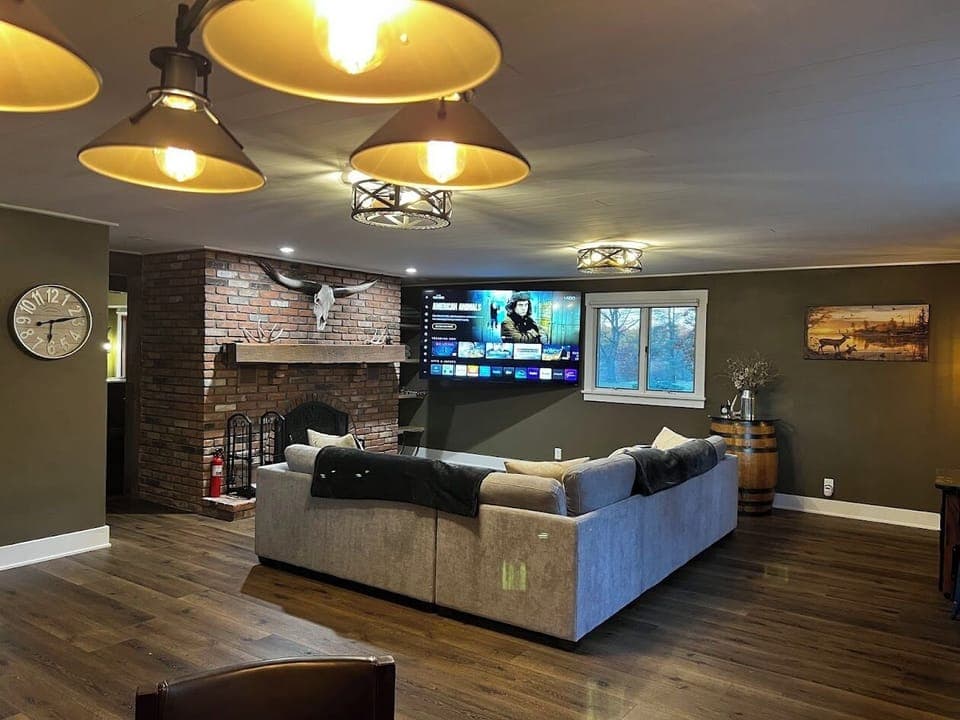 Great Room with wood burning fireplace and sleeper sofa