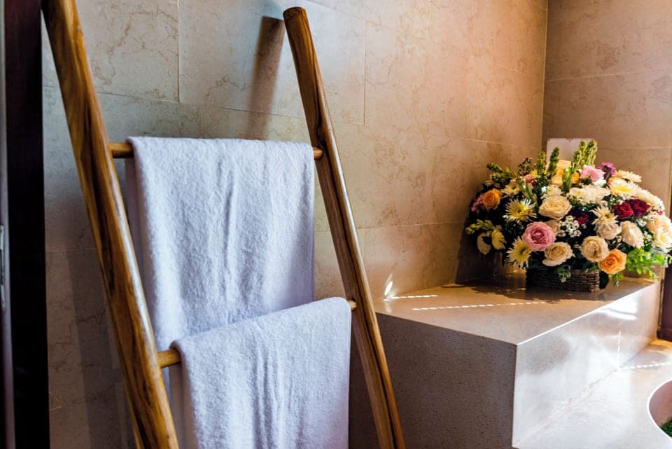 Separate tub and shower, hair dryer, slippers, towels