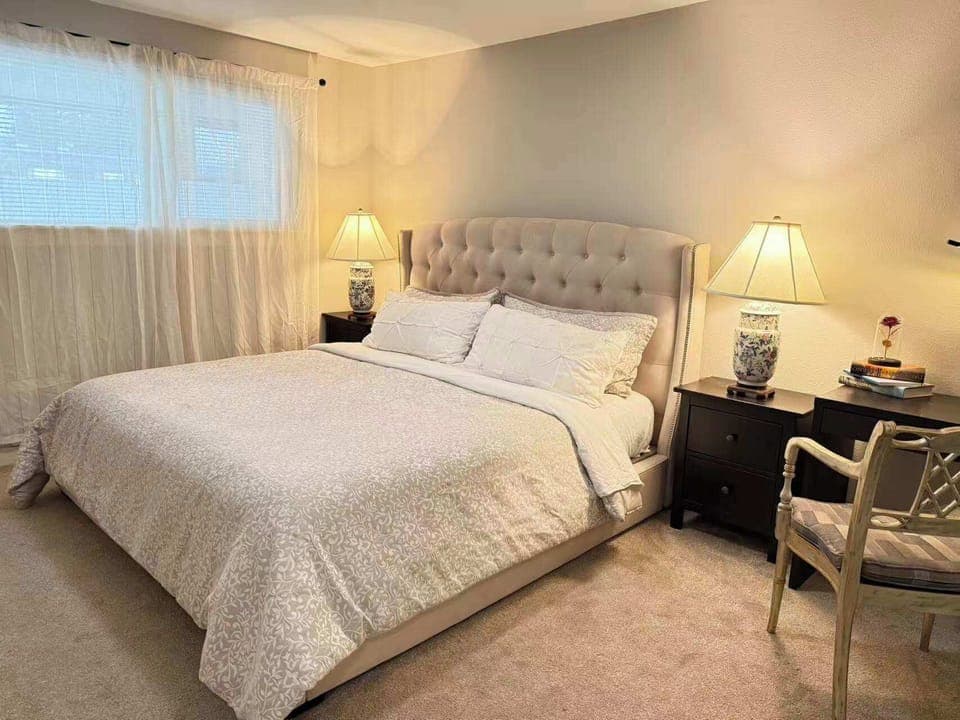 
Drift off to sleep in your tranquil, private haven—a bright bedroom designed for deep comfort and rest.