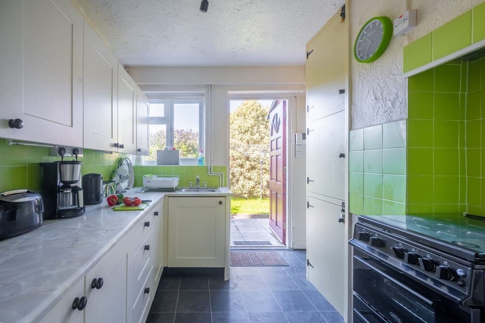 Ground floor: Practical kitchen with pops of colour