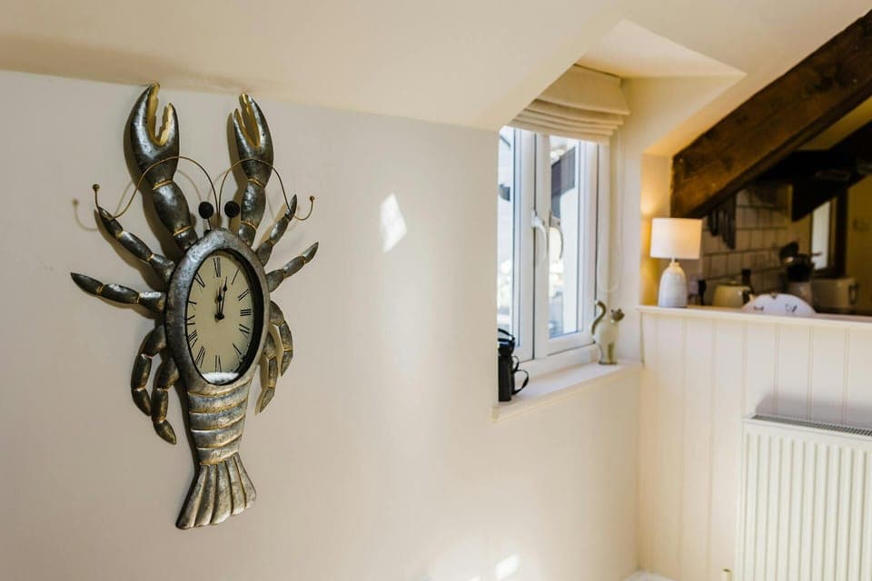 Close up shot of a novelty clock on the wall.