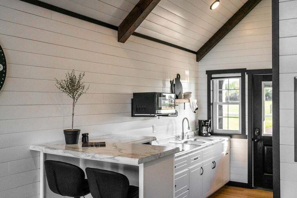 Enjoy meals at the kitchenette bar with seating for two.