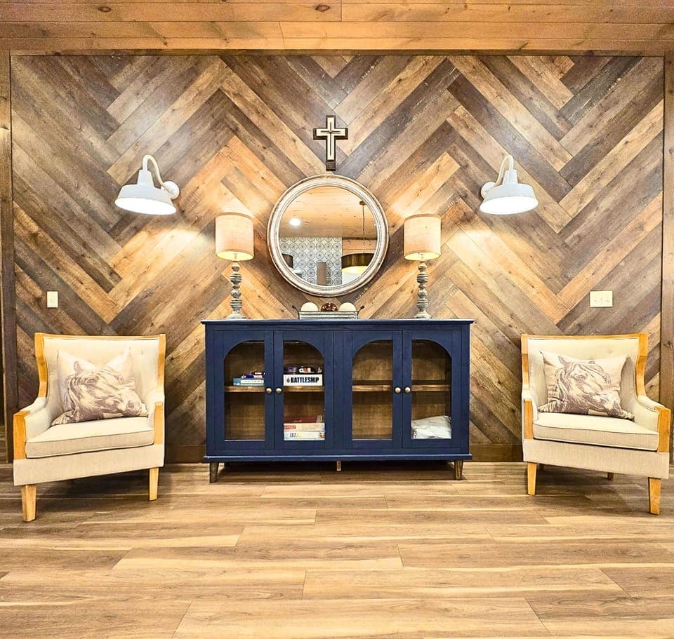 Inviting entrance with comfy seating across from the kitchen 