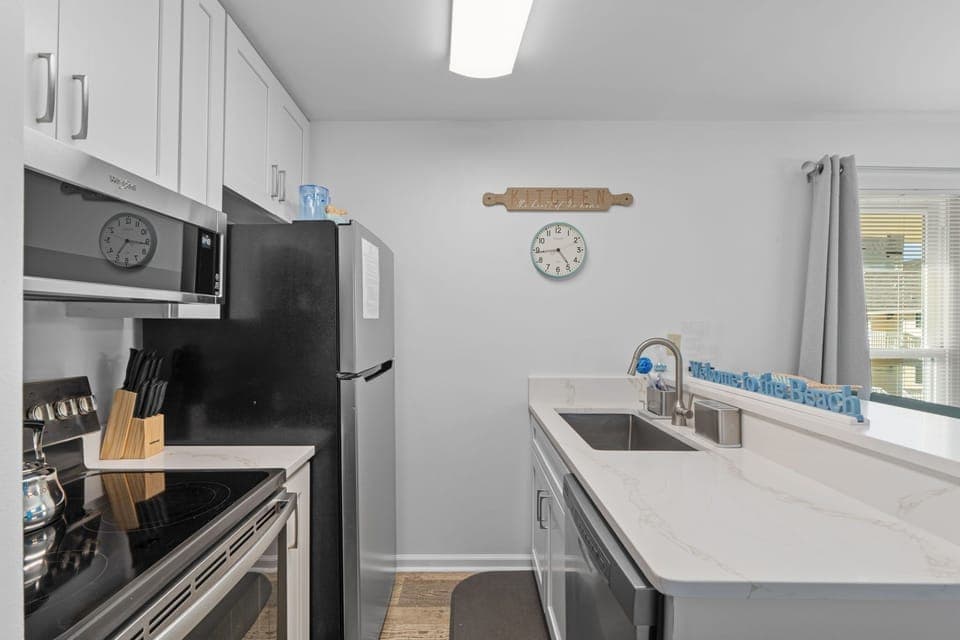 Your fully equipped kitchen awaits with modern appliances, ample counter space, and everything you need to prepare meals during your stay.