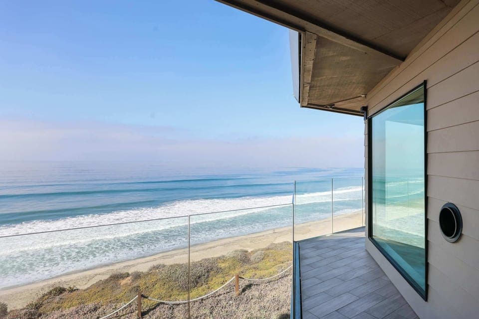 Step outside onto the glass-railing balcony for truly unobstructed, panoramic ocean and beach views. Perfect for sunbathing, enjoying coffee, or watching surfers