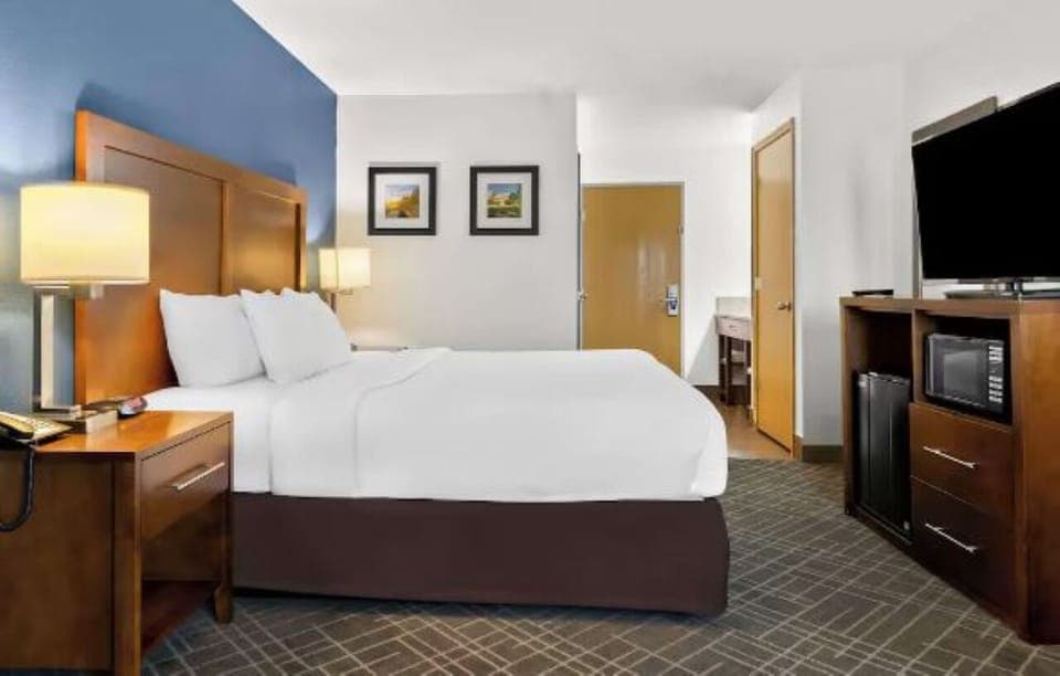 Settle in for a restful night with crisp sheets and warm lighting.