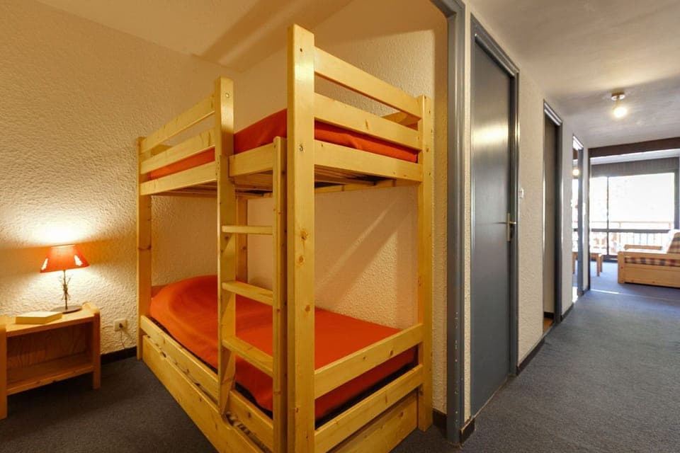 Cozy sleeping alcove with bunk beds, ideal for families.