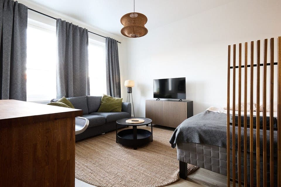 Enjoy a versatile living space that comfortably accommodates up to four guests with a double bed and a cozy sofa bed. The layout is designed to feel spacious and functional for both short and long stays.