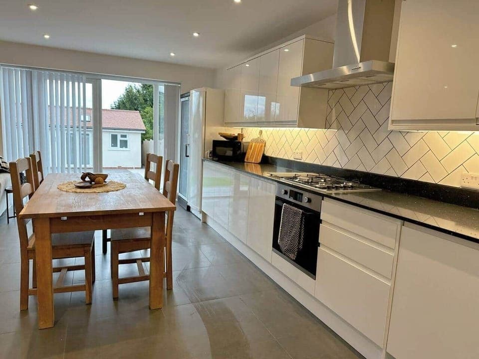 Open plan kitchen with dining table