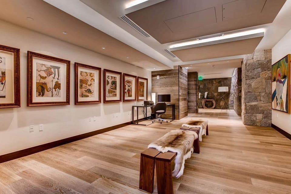 A refined gallery corridor showcasing the art and soul of Vail — every detail crafted for elegance and calm.