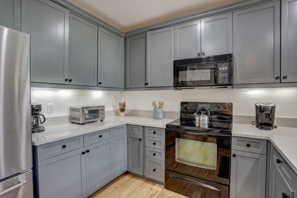 The modern kitchen pairs mountain charm with contemporary convenience—perfect for shared meals after a day on the slopes.