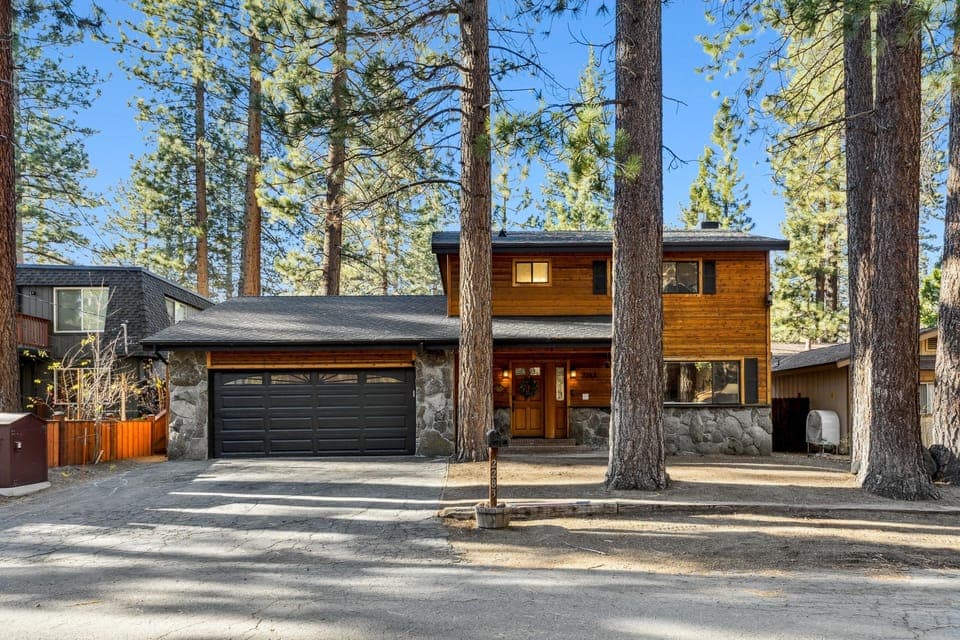 Spacious modern cabin surrounded by towering pine trees