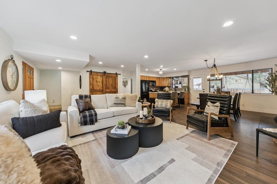 Spacious open-concept living area with cozy seating and natural light