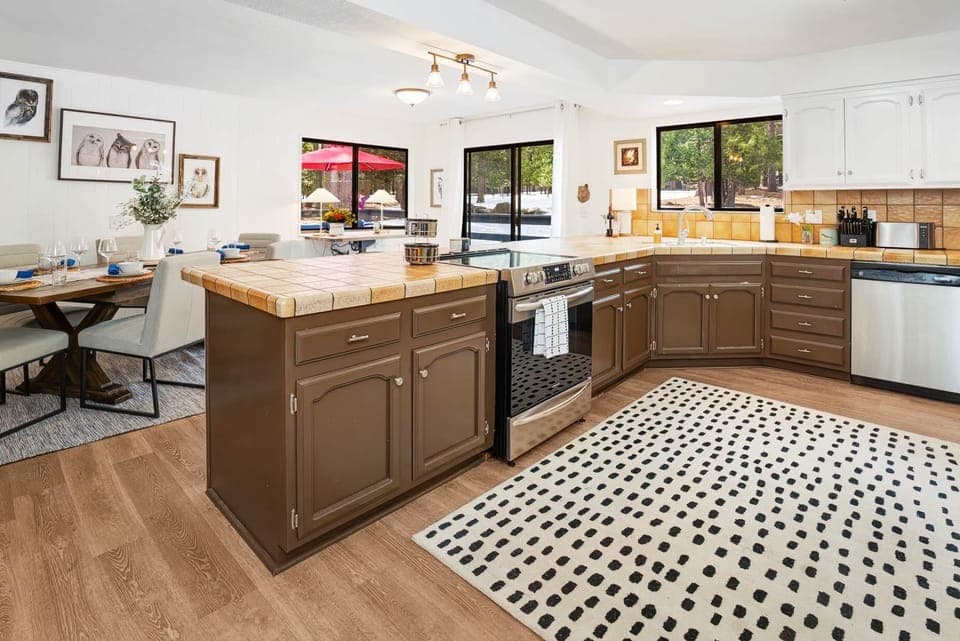 View from laundry area to dining table and outside patio