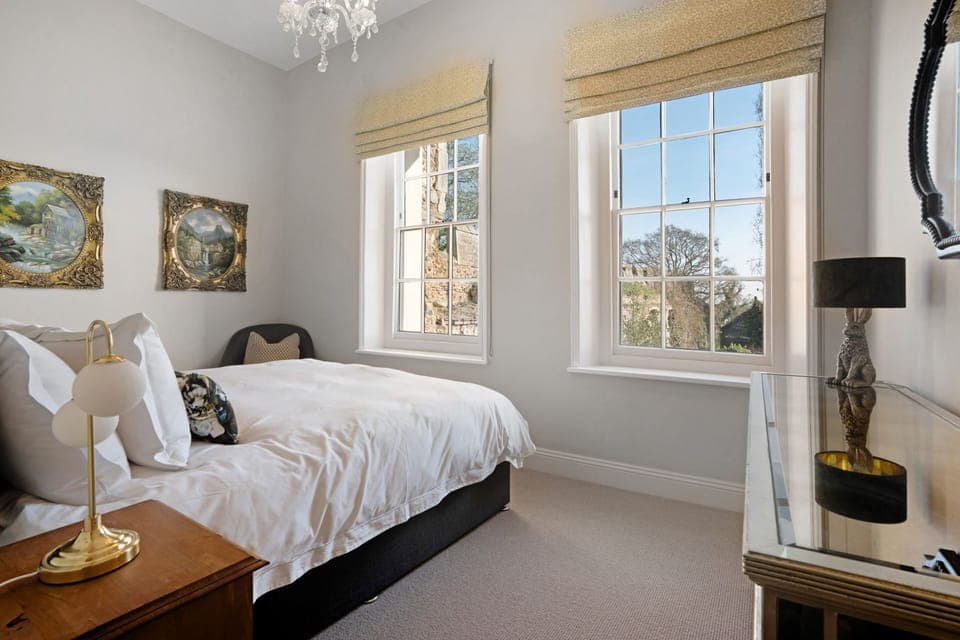 A super-king sized bedroom at Priory West Gate, Essex
