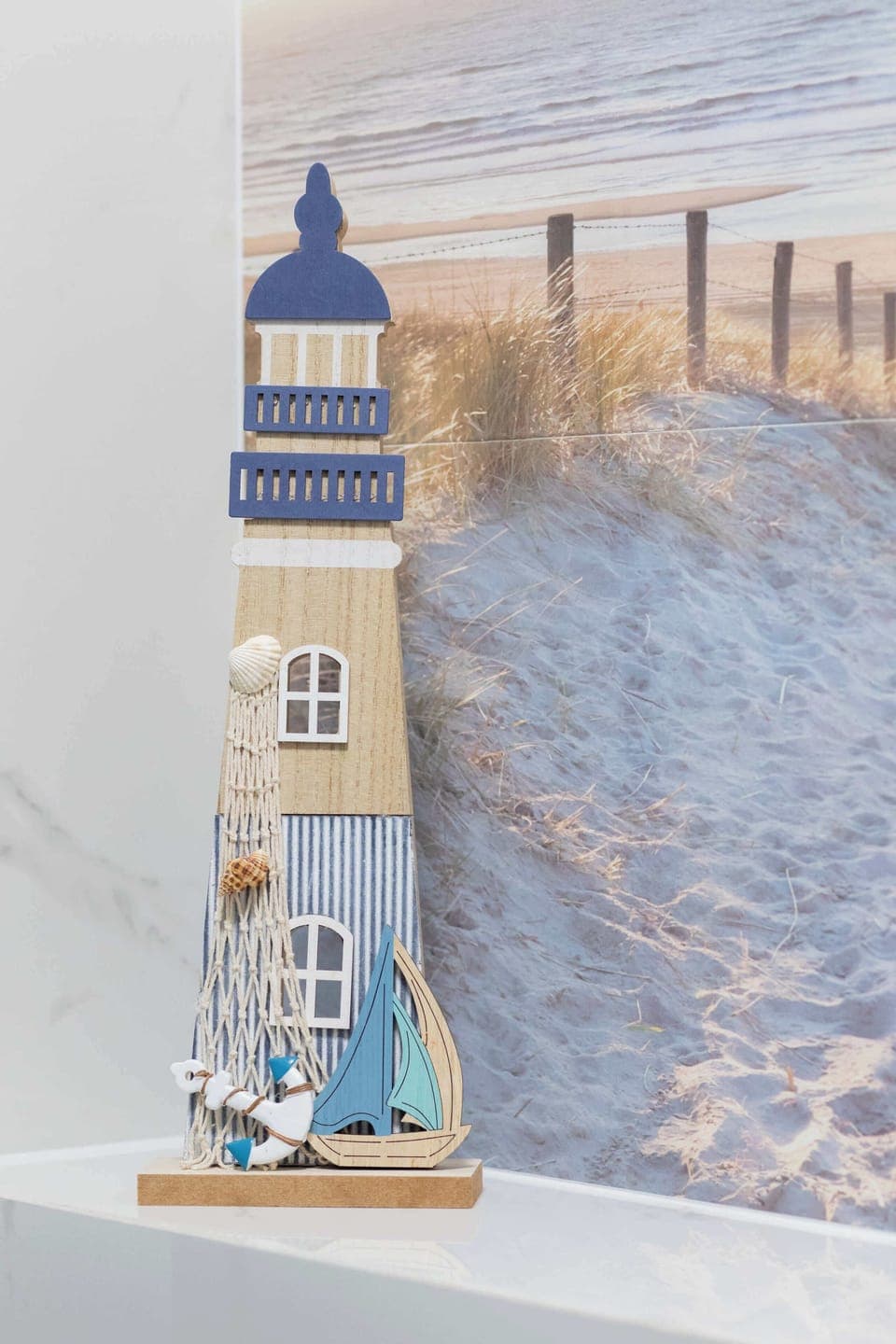 Shelf with decorative lighthouse.