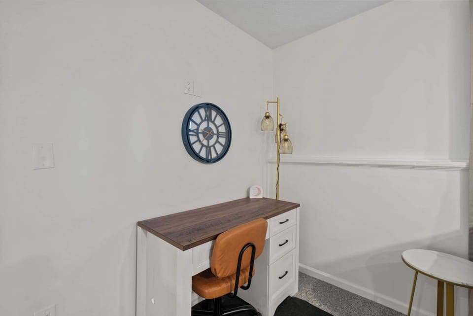 Catch up on emails or enjoy a book at the living room’s desk workspace​