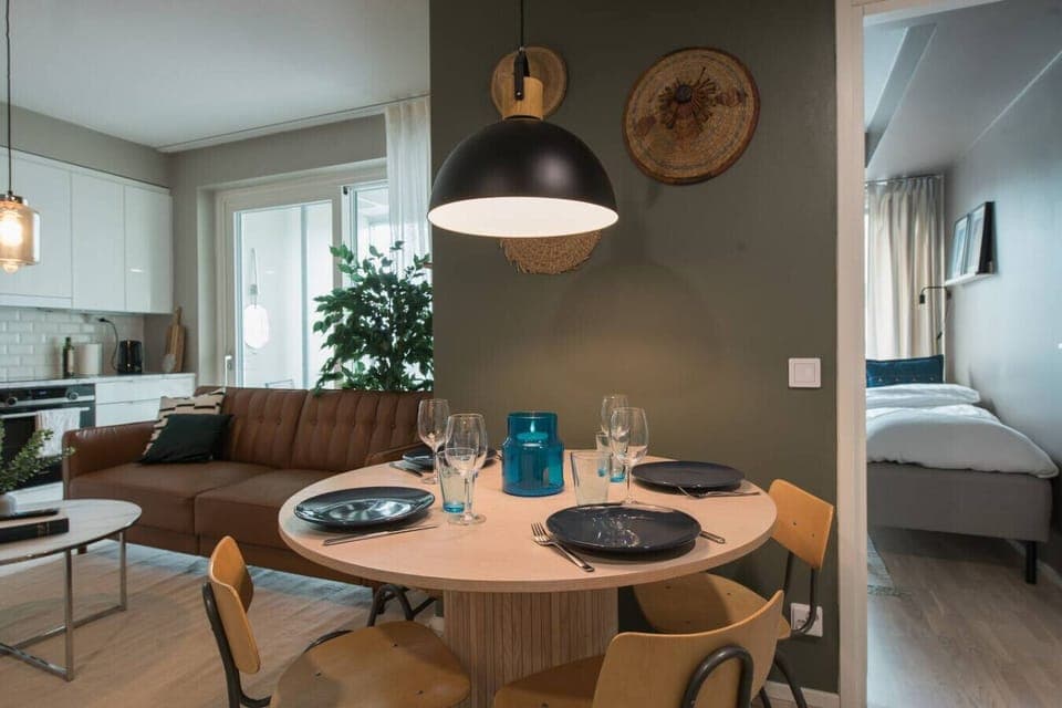 Gather around this stylish dining table, the perfect spot for meals or planning your Helsinki adventures. Whether you`re enjoying a homemade dinner or takeout from a local favorite, this space is designed for comfort and great conversation.