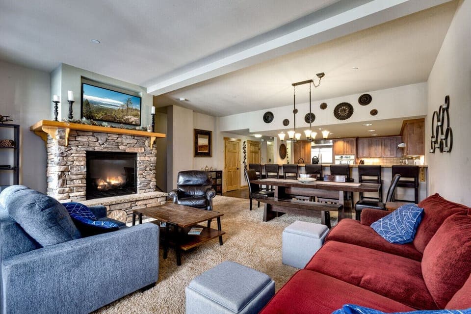 The open floor plan connects the living room to the dining area and modern kitchen, ideal for family gatherings and entertaining.