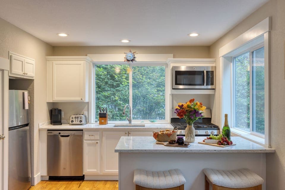A bright, well-appointed kitchen perfect for preparing a delicious meal.