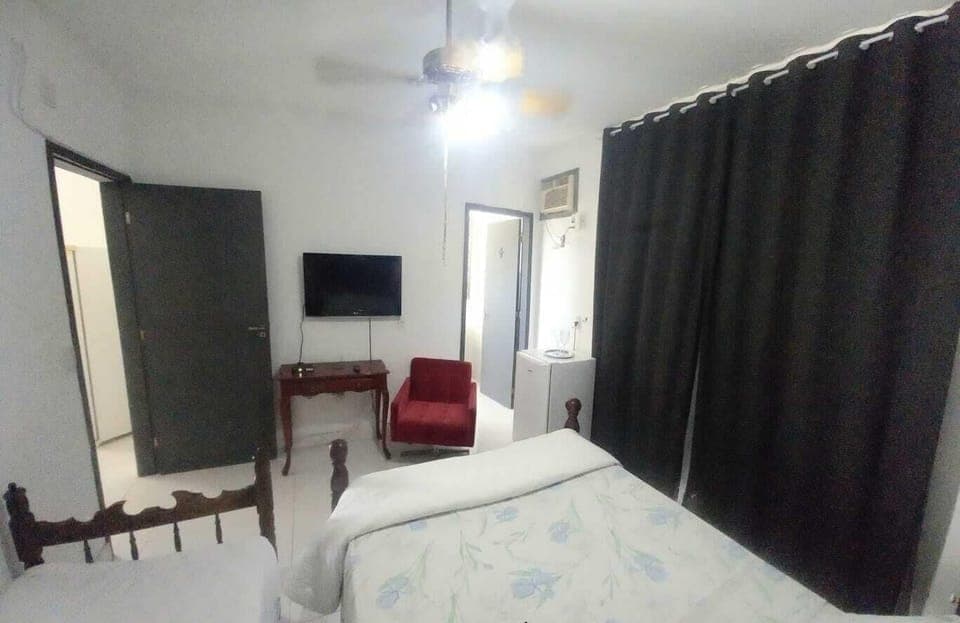 Deluxe Suite, Garden View | Blackout drapes, iron/ironing board, free WiFi