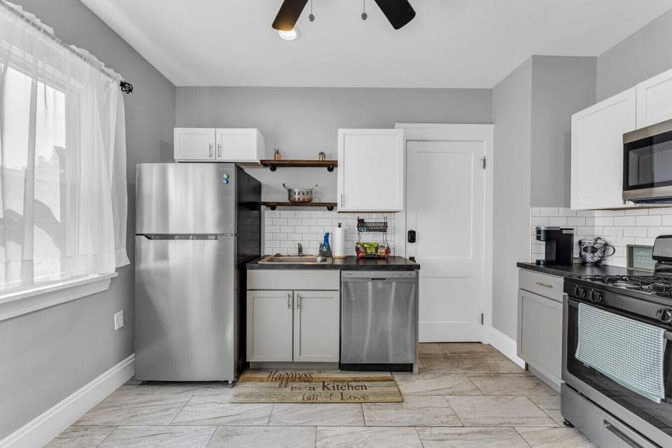 Bright, simple kitchen offering everything within easy reach.