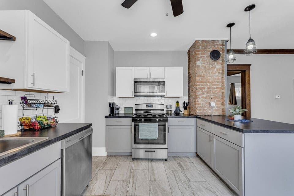 Clean, modern kitchen offering simple storage & a breezy layout.