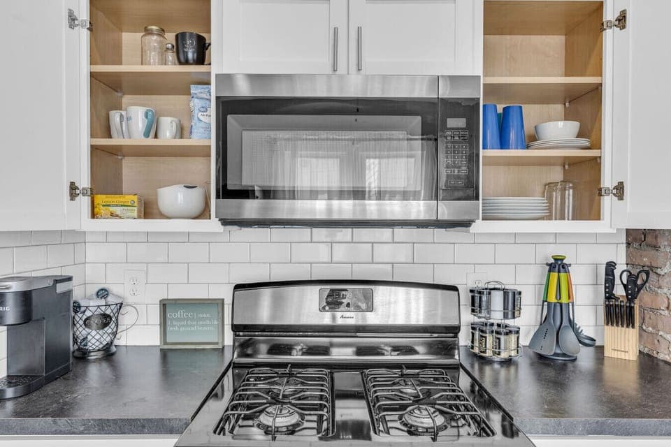 Streamlined kitchen offering bright workspace & essentials.