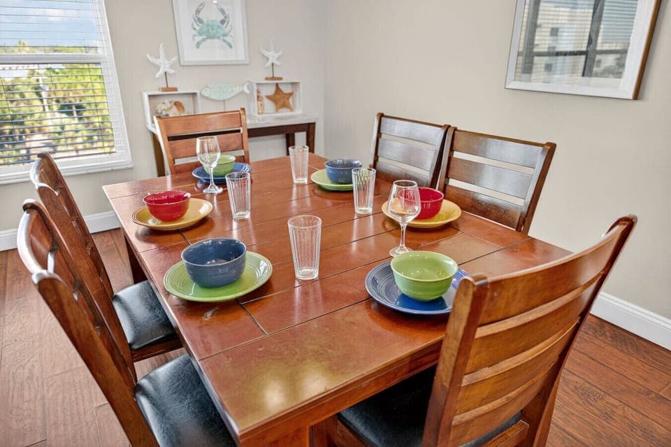 Welcoming dining table set for shared meals, perfect for gathering over good food & conversation.