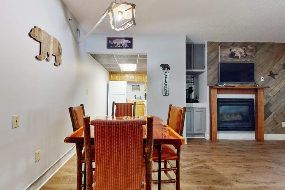 Dining area awaits. A rustic charm awaits around this vibrant table, perfect for meals and memories!
