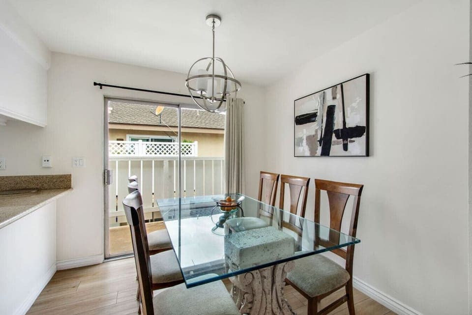 Dining area with table seating for six and patio access