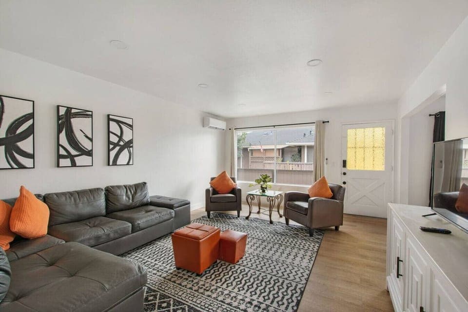 Cozy living room with comfortable seating and a Smart TV.