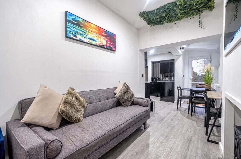 Open-plan living area with sofa and dining table