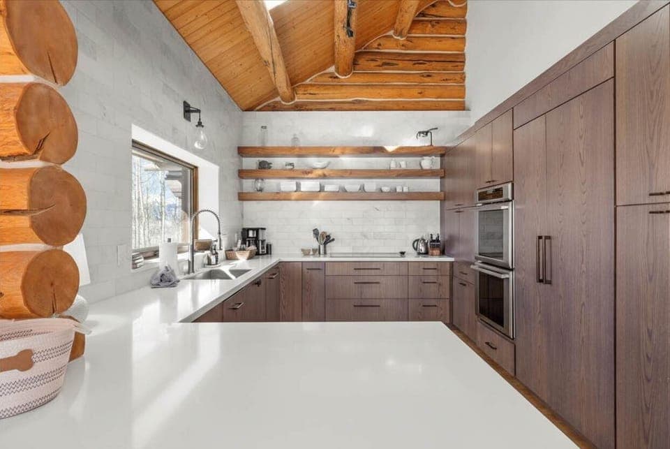 Kitchen: Drip coffee maker, toaster oven, kettle, cooking utensils, tableware