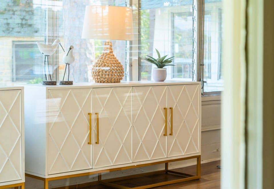 Elegant entry console with chic decor and warm lighting, setting a welcoming tone as you arrive.